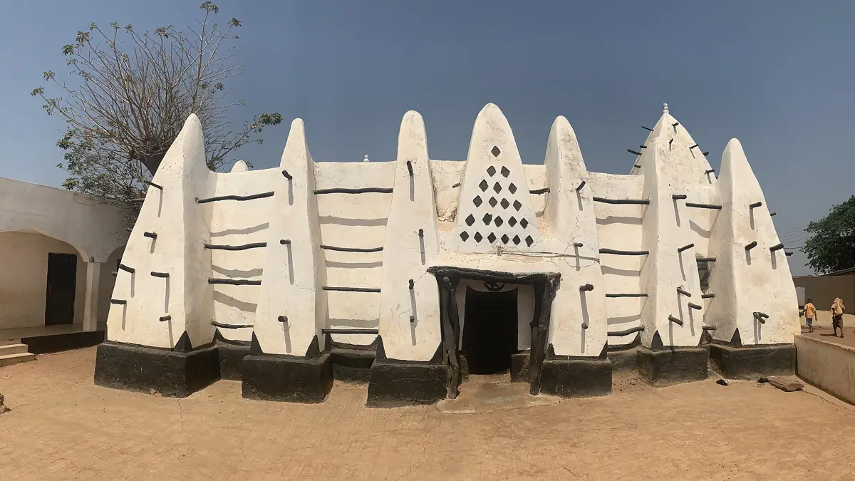 Larabanga Mosque with its white walls and projecting wooden supports